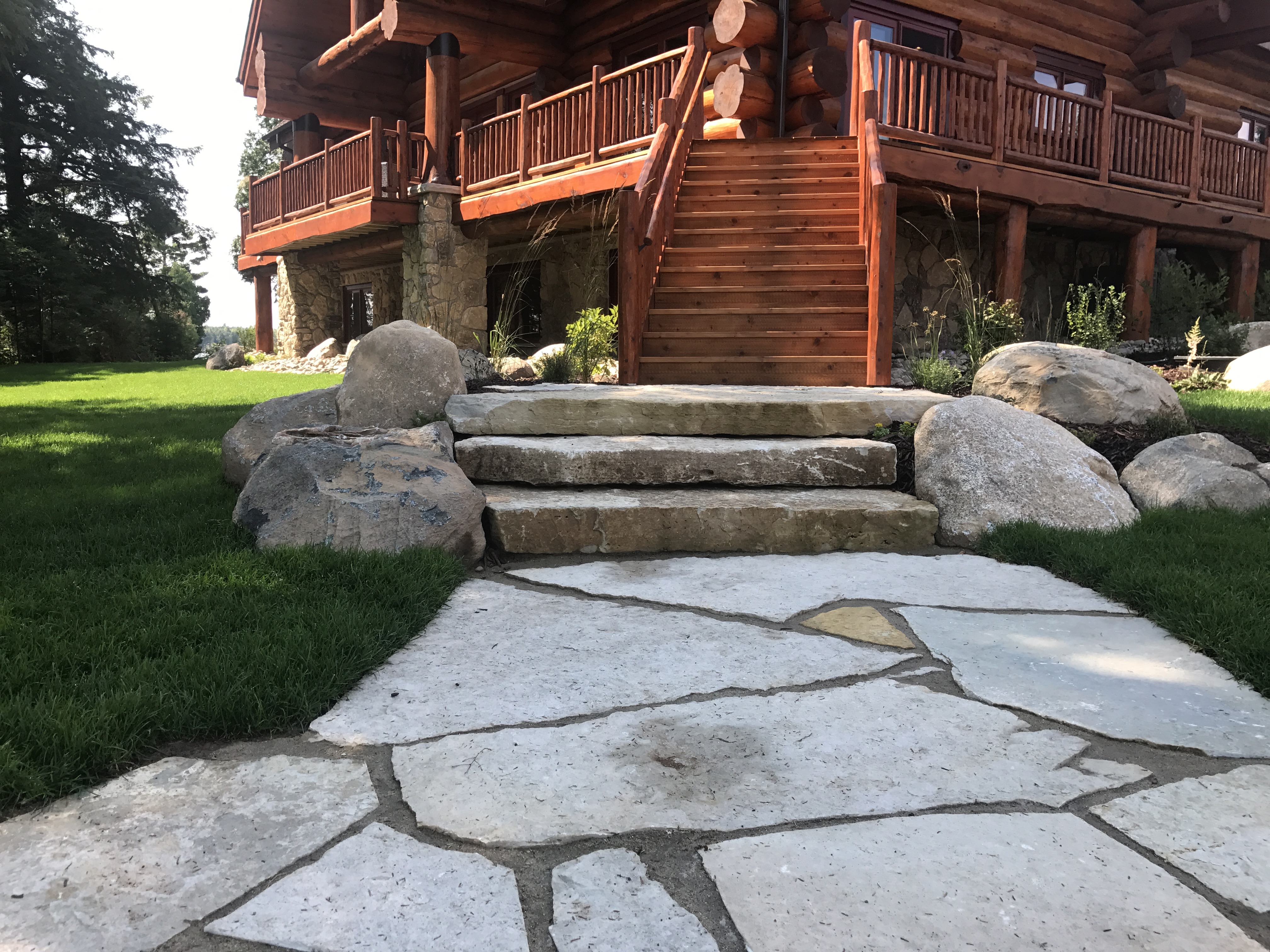 peninsula stone door county WE treads & flagstone patio